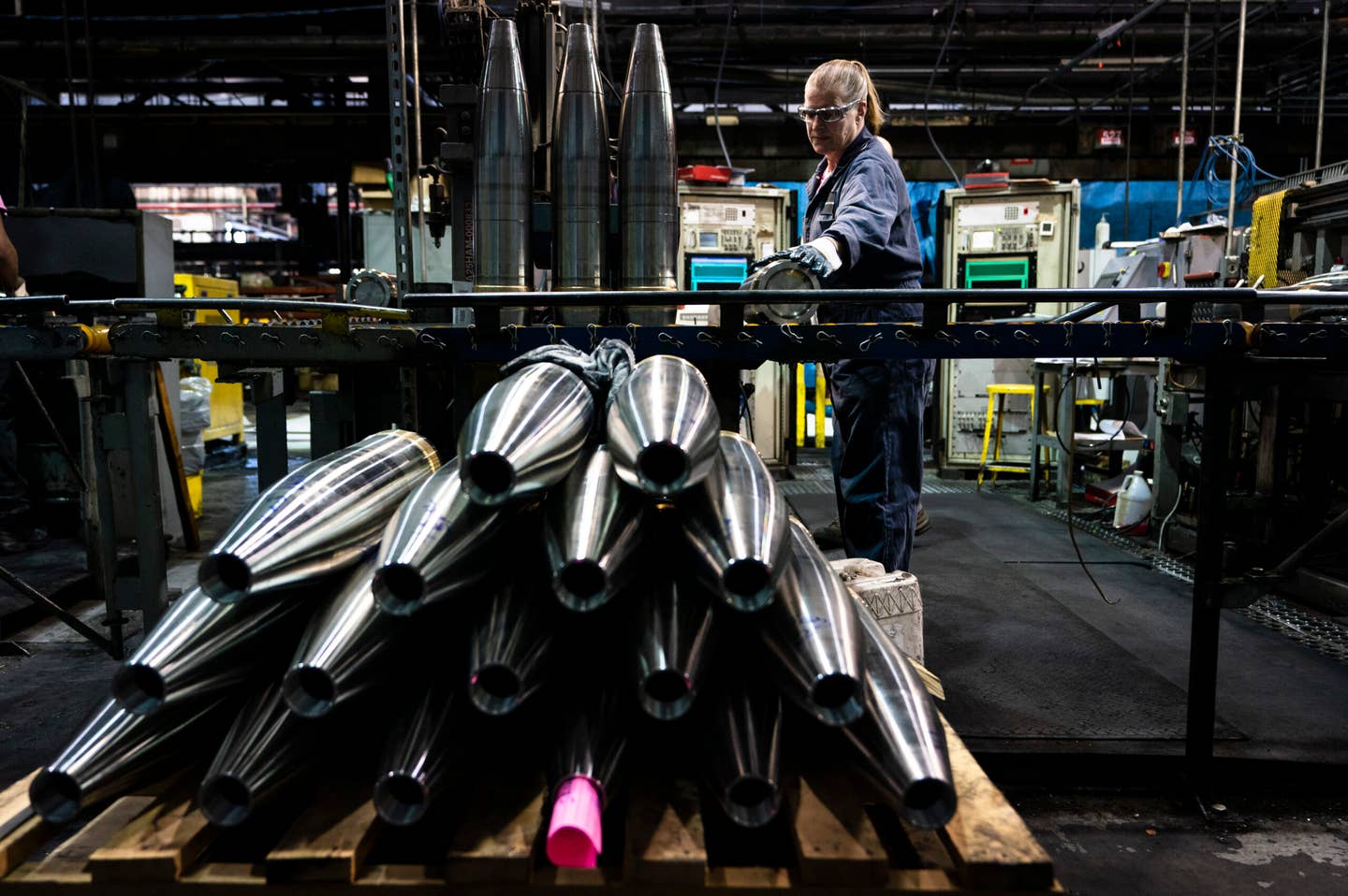 A steel worker moves a 155 mm M795 artillery projectile during the manufacturing process at the Scranton Army Ammunition Plant in Scranton, Pa. (AP Photo/Matt Rourke)