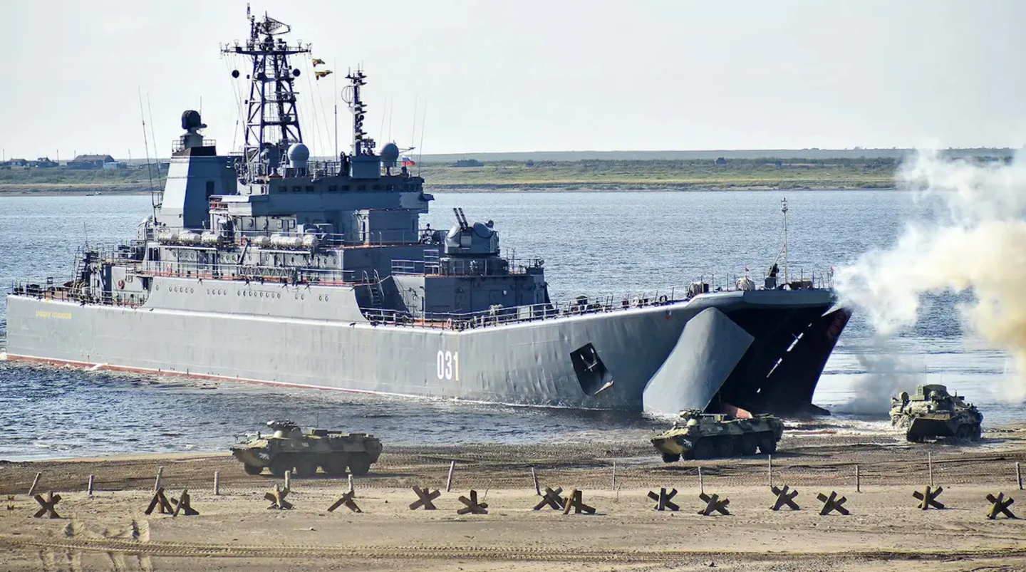 BTR-82 armored personnel carriers disembark from a <em>Ropucha</em> class landing ship during an exercise. <em>DENIS KOZHEVNIKOV/TASS VIA GETTY IMAGES</em>