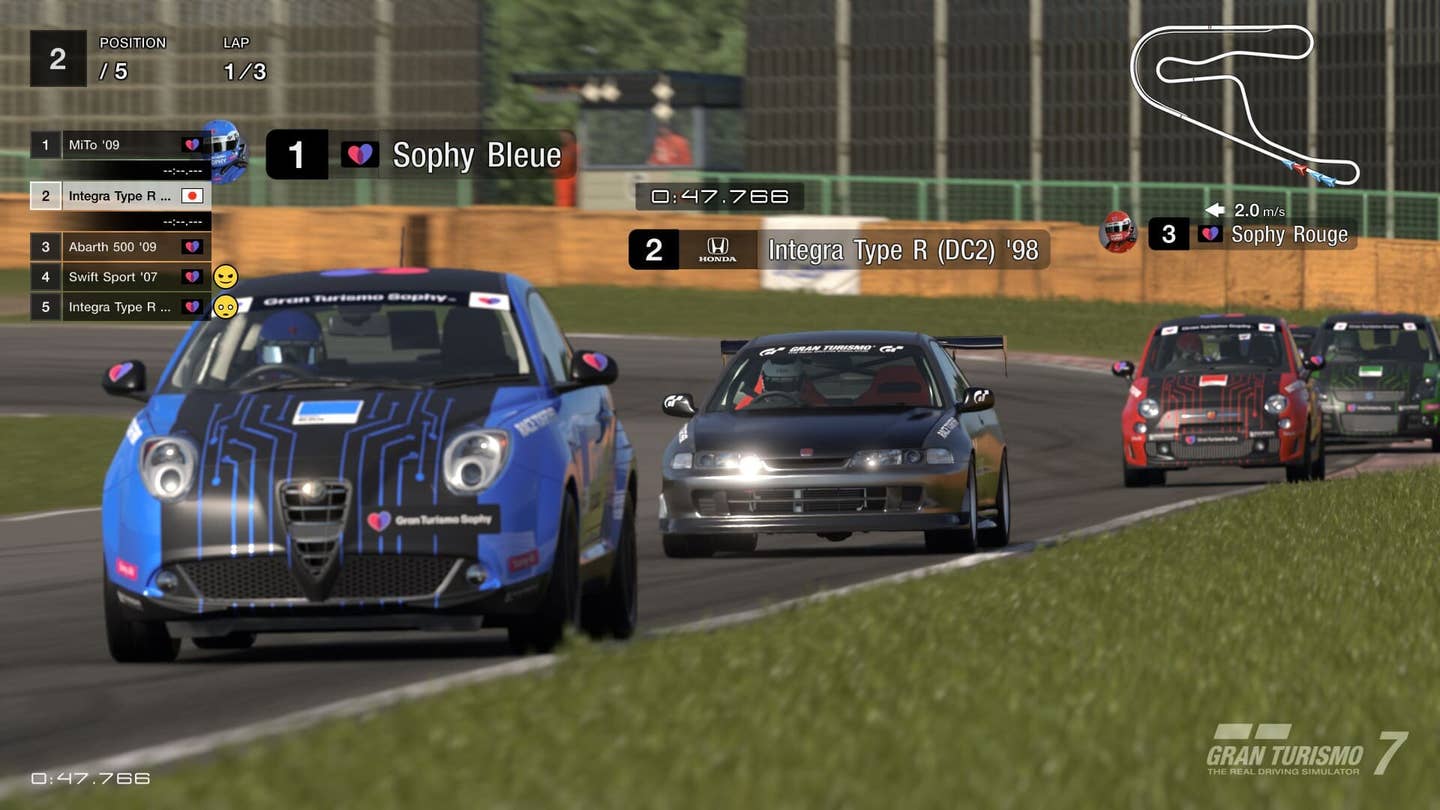 A player car races against Gran Turismo Sophy AI agents in Gran Turismo 7 on the Tsukuba Circuit.