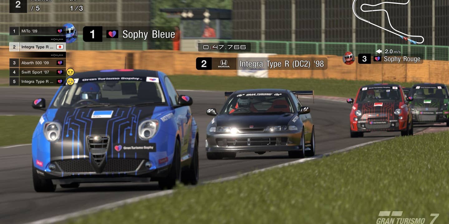 A player car races against Gran Turismo Sophy AI agents in Gran Turismo 7 on the Tsukuba Circuit.