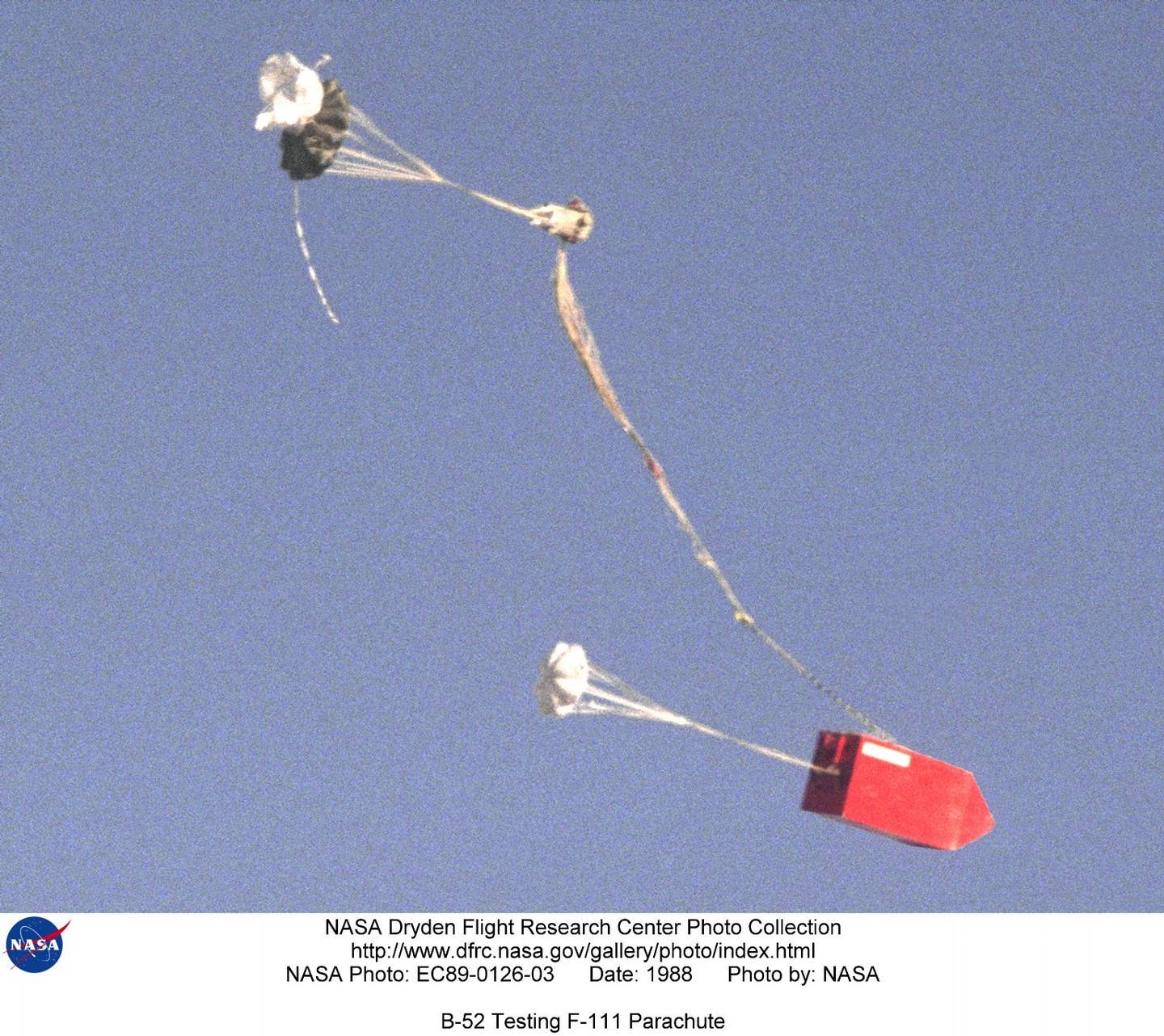 In the late 1980s, NASA used a B-52 for drop tests of a new parachute design for the F-111's escape module. (NASA)