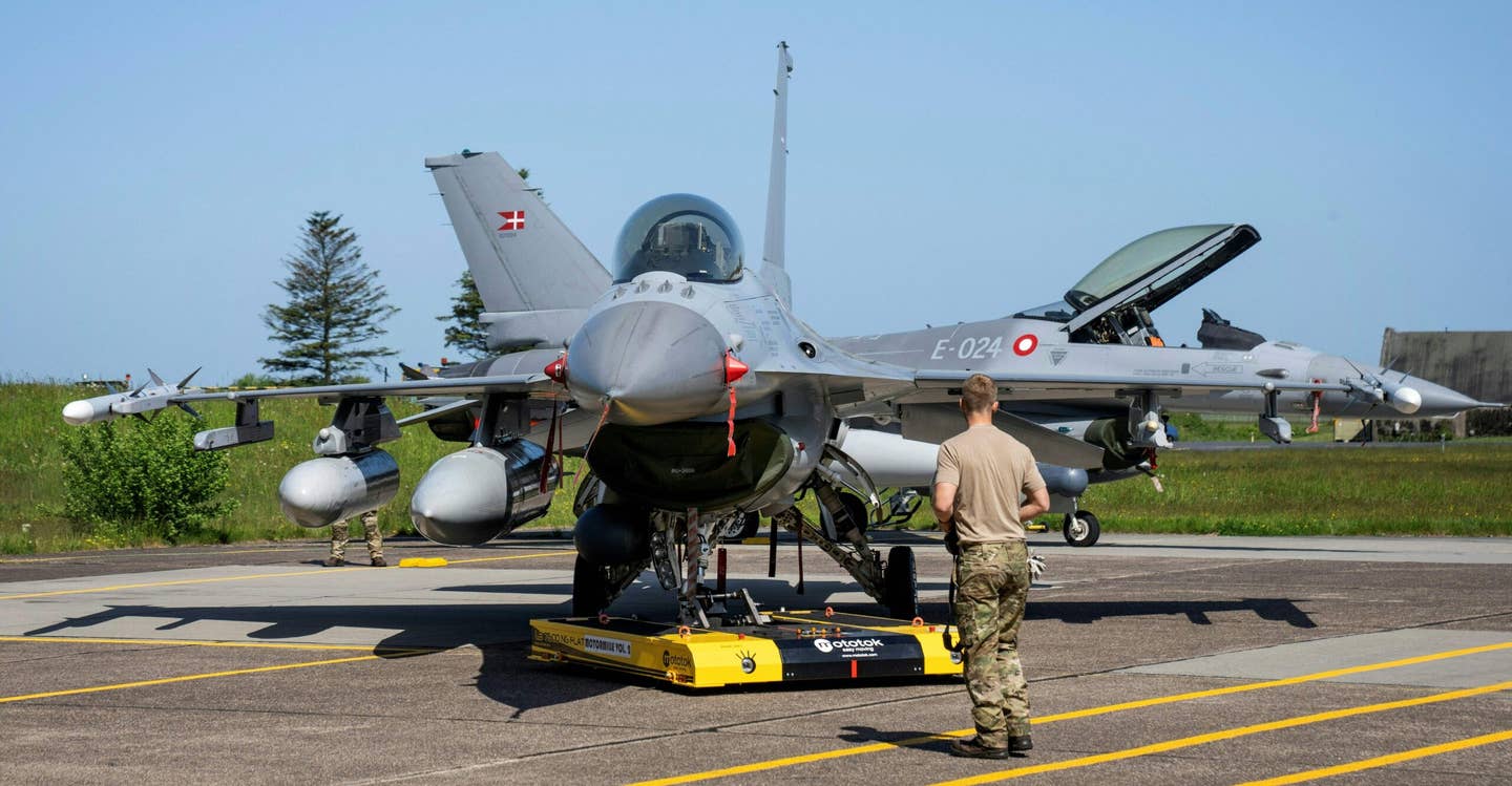 A Danish F-16 fighter jet with rockets is pictured at the Fighter Wing Skrydstrup Air Base near Vojens, Denmark. (Photo by Bo Amstrup / Ritzau Scanpix / AFP) / Denmark OUT (Photo by BO AMSTRUP/Ritzau Scanpix/AFP via Getty Images)