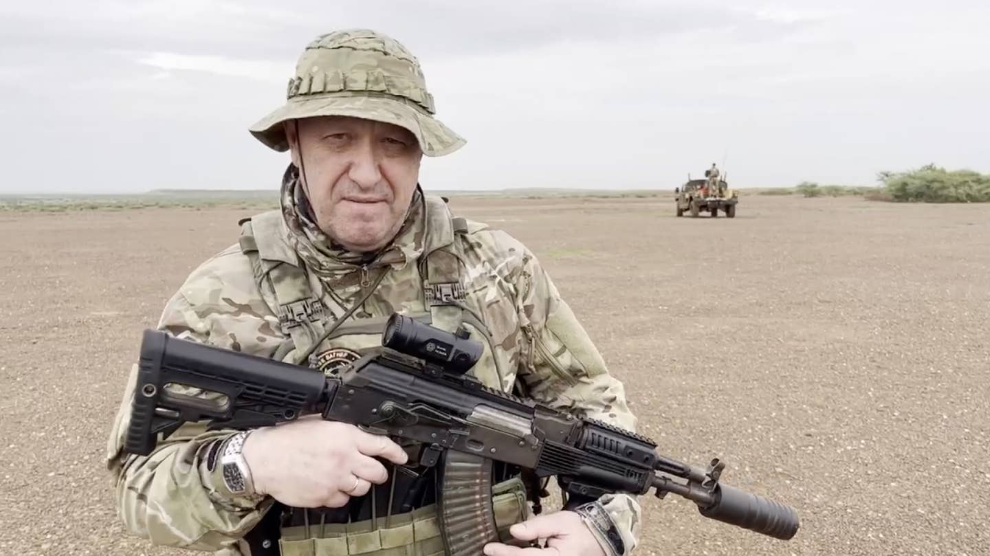 A screen grab from a video shared online shows Yevgeny Prigozhin, the founder of the Wagner Group, holding a rifle in a desert area, in an unspecified location in Africa on August 21, 2023. <em>Photo by Wagner Account/Anadolu Agency via Getty Images</em>