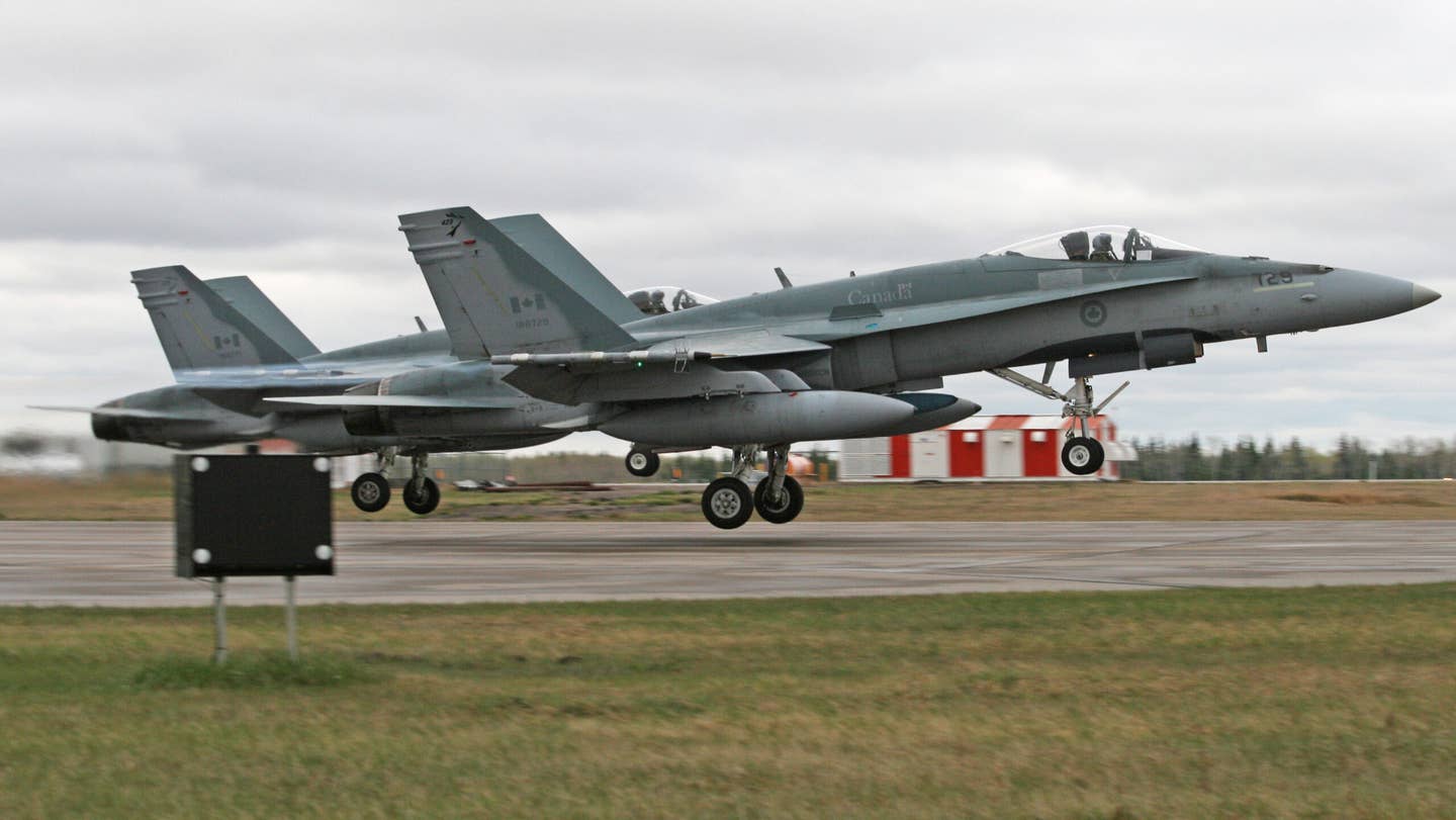 A pair of Canadian Hornets takeoff on a training mission. Credit: RAF-YYC/wikicommons
