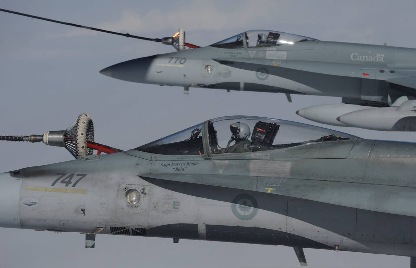 A pair of RCAF CF-18s refueling, their false canopies clearly visible. Credit: DoD photo by Cpl. Vicky Lefrancois, Royal Canadian Air Force