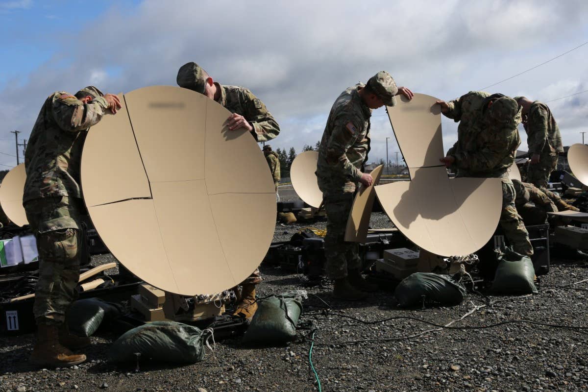Project Manager Tactical Network, Program Executive Office for Command Control Communications-Tactical (PEO C3T), conducts Scalable Network Node (SNN) new equipment training for the 51st Expeditionary Signal Battalion (ESB) – converting the unit to a modernized ESB-Enhanced (ESB-E) formation – at Joint Base Lewis McChord, Washington. The SNN provides a significant reduction in the footprint requirements of an ESB-E. (Amy Walker, Project Manager Tactical Network, PEO C3T public affairs)