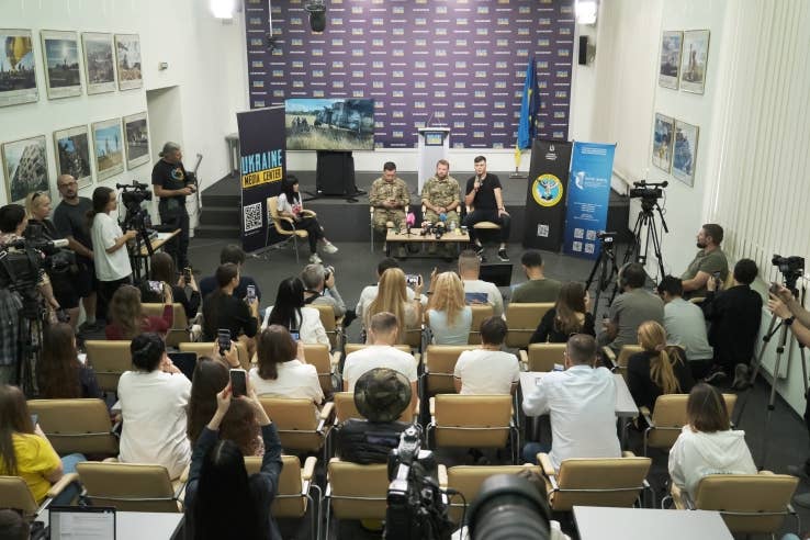 Maxim Kuzminov, a former Russian Mi-8 helicopter pilot who defected to Ukraine last month, explains the incident at a press briefing in Ukraine. (Ukraine Media Center photo)
