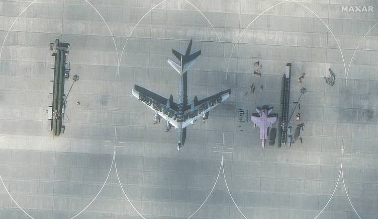 Another closeup of a Russian Tu-95 Bear bomber with tires on the wings and top of the center fuselage at Engels Air Base, taken Aug. 28. (Satellite image ©2023 Maxar Technologies)&nbsp;