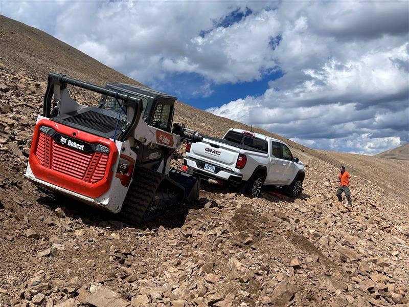 A Bobcat skid steer saves the grounded GMC Canyon AT4