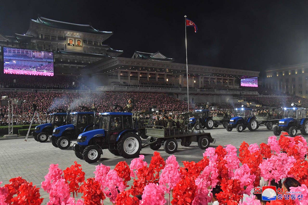 Civilian tractors were seen pulling trailers with anti-tank missiles, rocket artillery, and anti-aircraft guns attached. (KCNA)