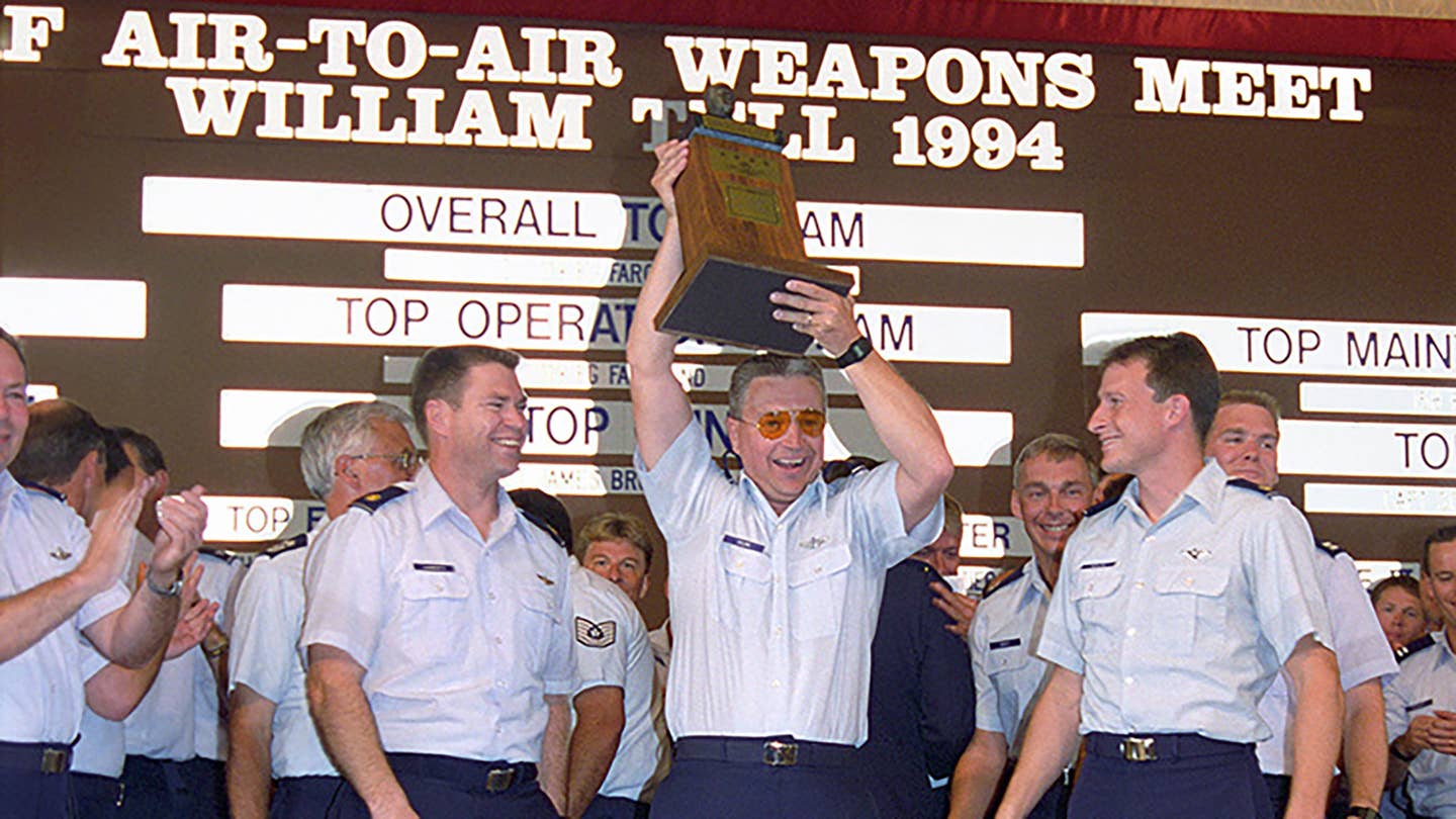 Maj. Robert Edlund of the 119th Fighter Wing, North Dakota Air National Guard, with his "Top Gun" trophy at William Tell 1994. <em>USAF</em>