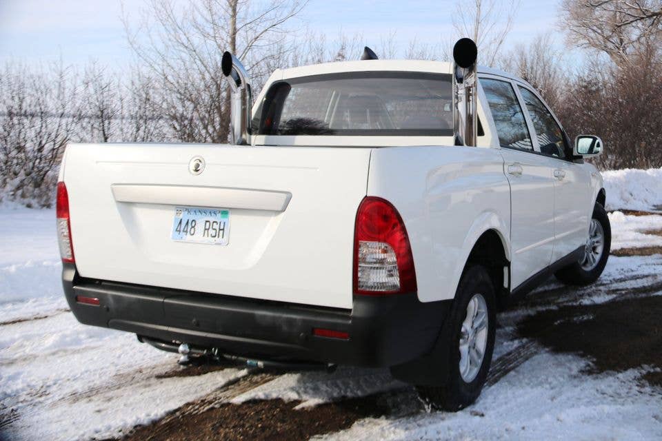 2008 Ssangyong Actyon Sports pickup truck with a Ford 289 V8 rear three-quarter