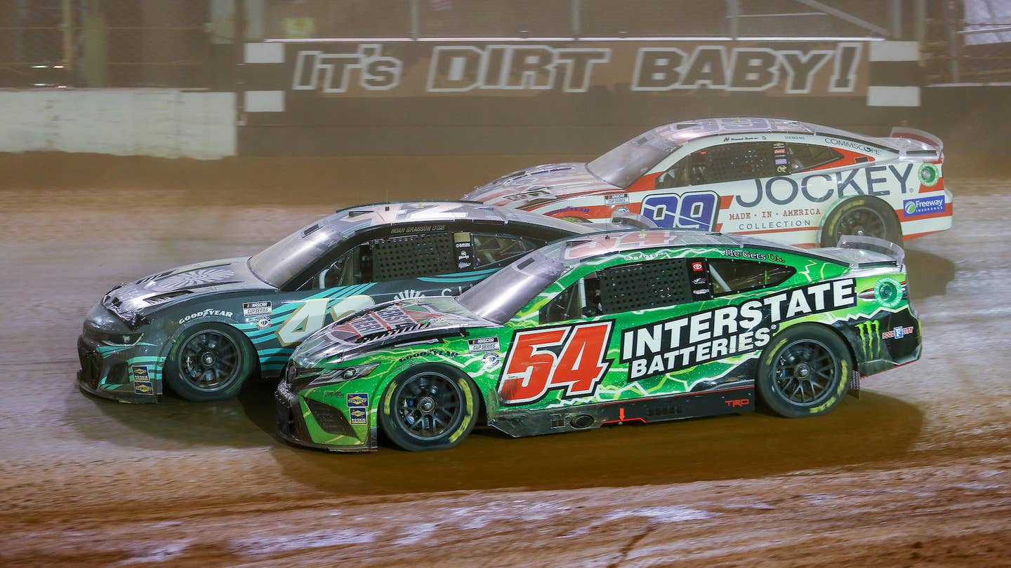 BRISTOL, TN - APRIL 09: NASCAR Cup Series driver Ty Gibbs (54), NASCAR Cup Series driver Noah Gragson (42), and NASCAR Cup Series driver Daniel Suarez (99) enter the third turn three wide during the Food City Dirt Race on April 9, 2023 at Bristol Motor Speedway in Bristol, TN. (Photo by Chris McDill/Icon Sportswire via Getty Images)