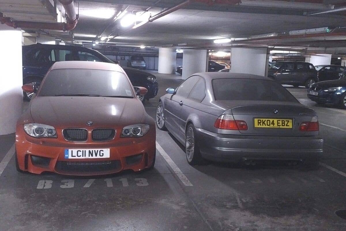 Abandoned 2004 BMW M3 CSL, alongside an unloved 1M Coupe owned by someone else.