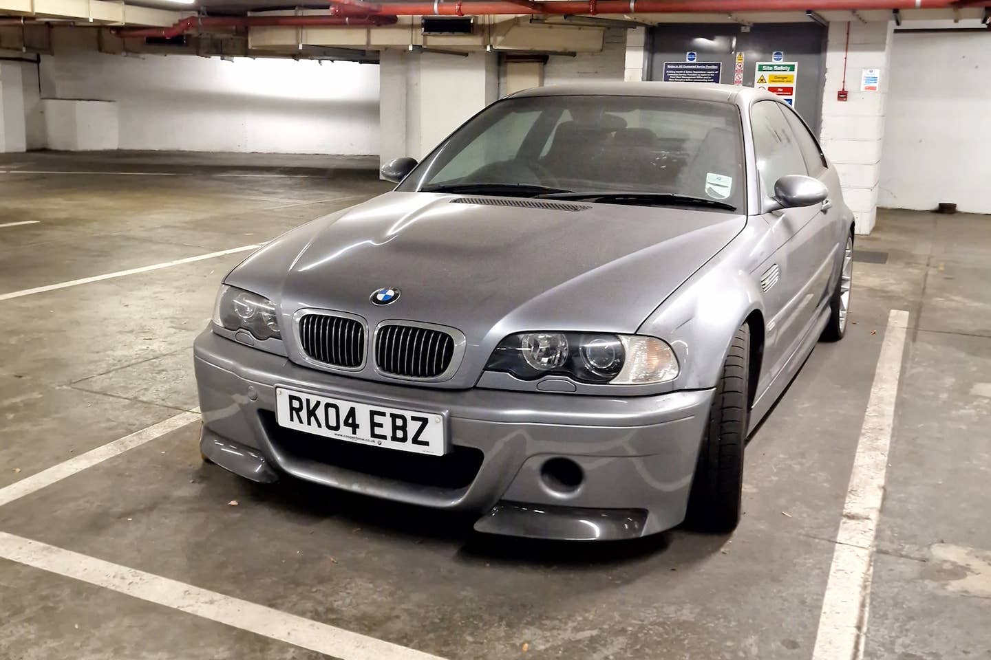 2004 BMW M3 CSL neglected in a London parking garage.