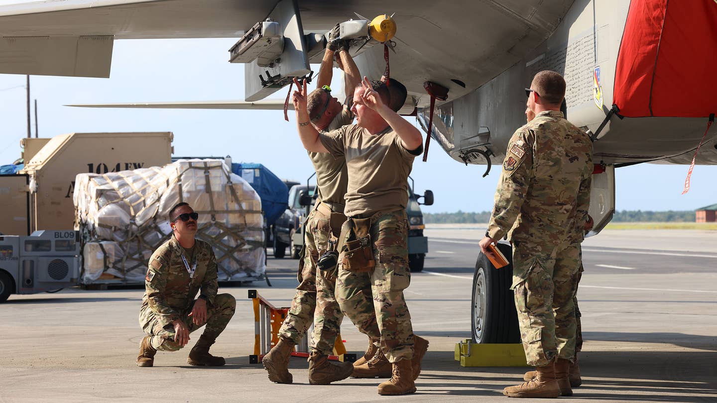 The weapons loading team from the 104th FW in action. <em>James Deboer</em>