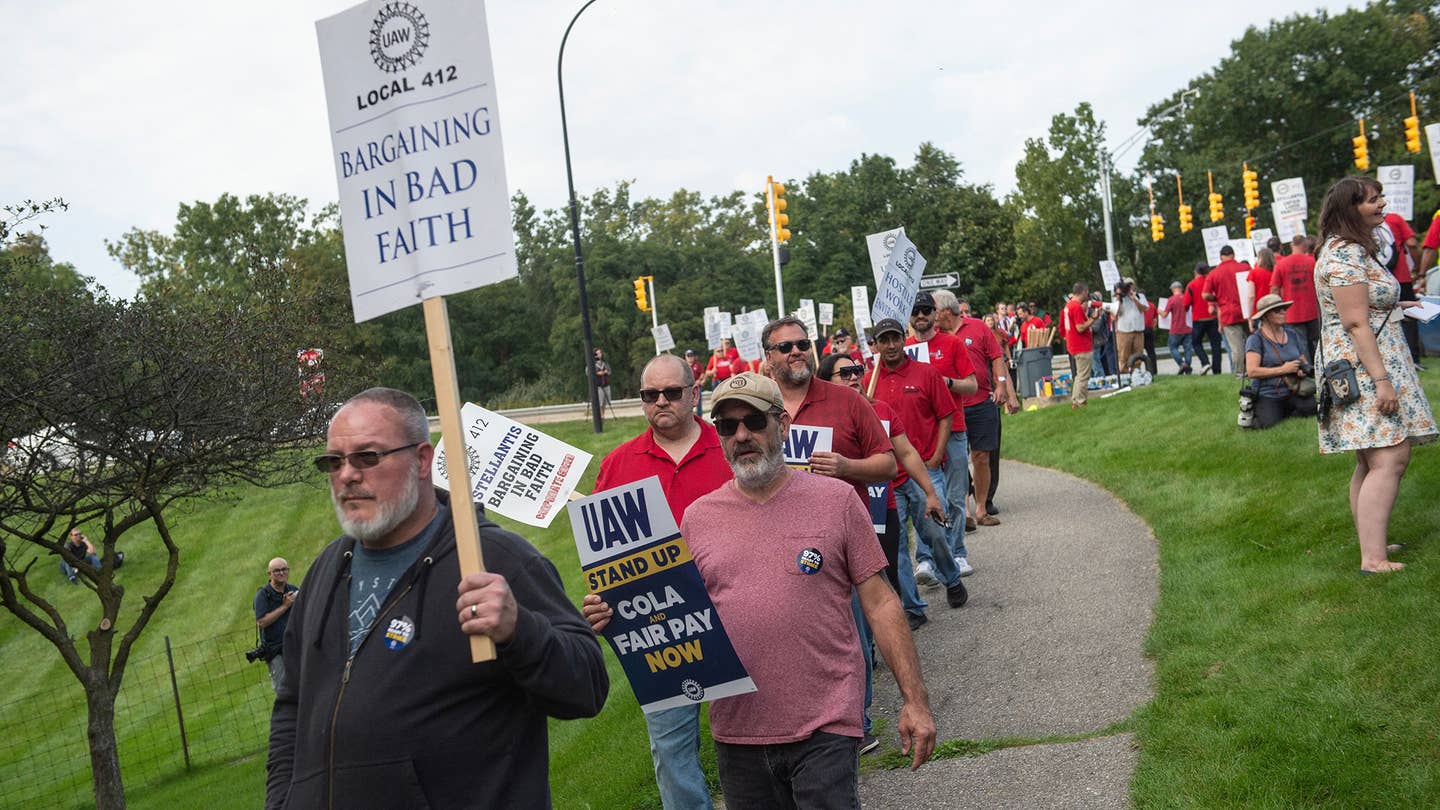 Members of the United Auto Workers (UAW) union hold a practice picket in front of Stellantis headquarters in Auburn Hills, Michigan, on September 20, 2023.