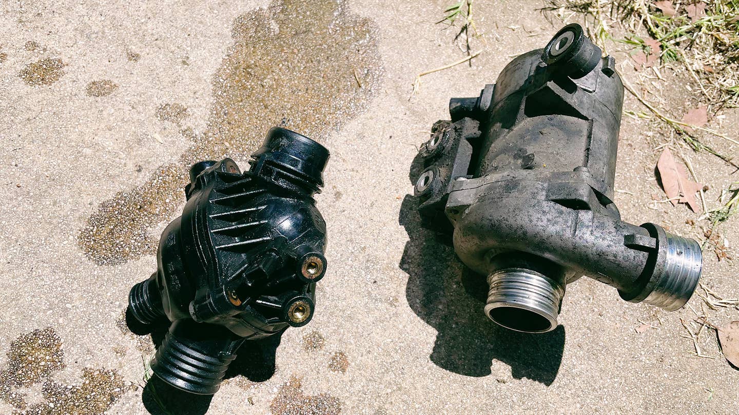 My BMW 128i's old water pump and thermostat