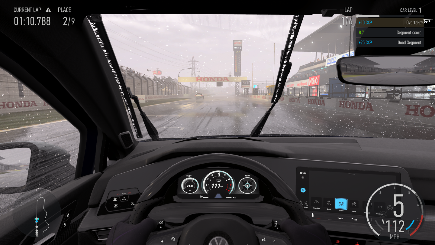 Gameplay capture from Forza Motorsport of the interior view of a Volkswagen Golf R being driven at Suzuka Circuit in the rain.