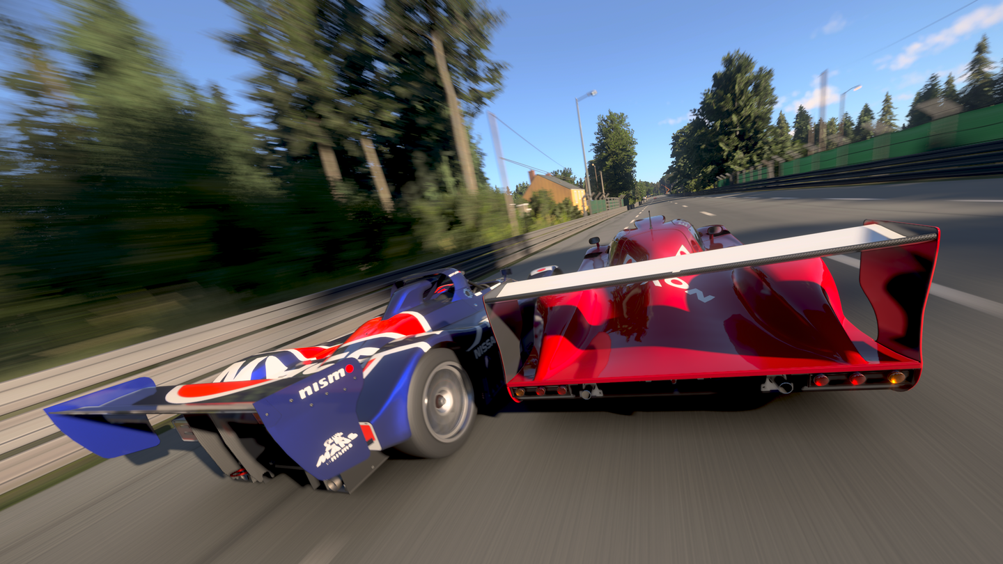 Photo Mode capture from Forza Motorsport of a Toyota GT-One and Nissan R391 racing at Le Mans.