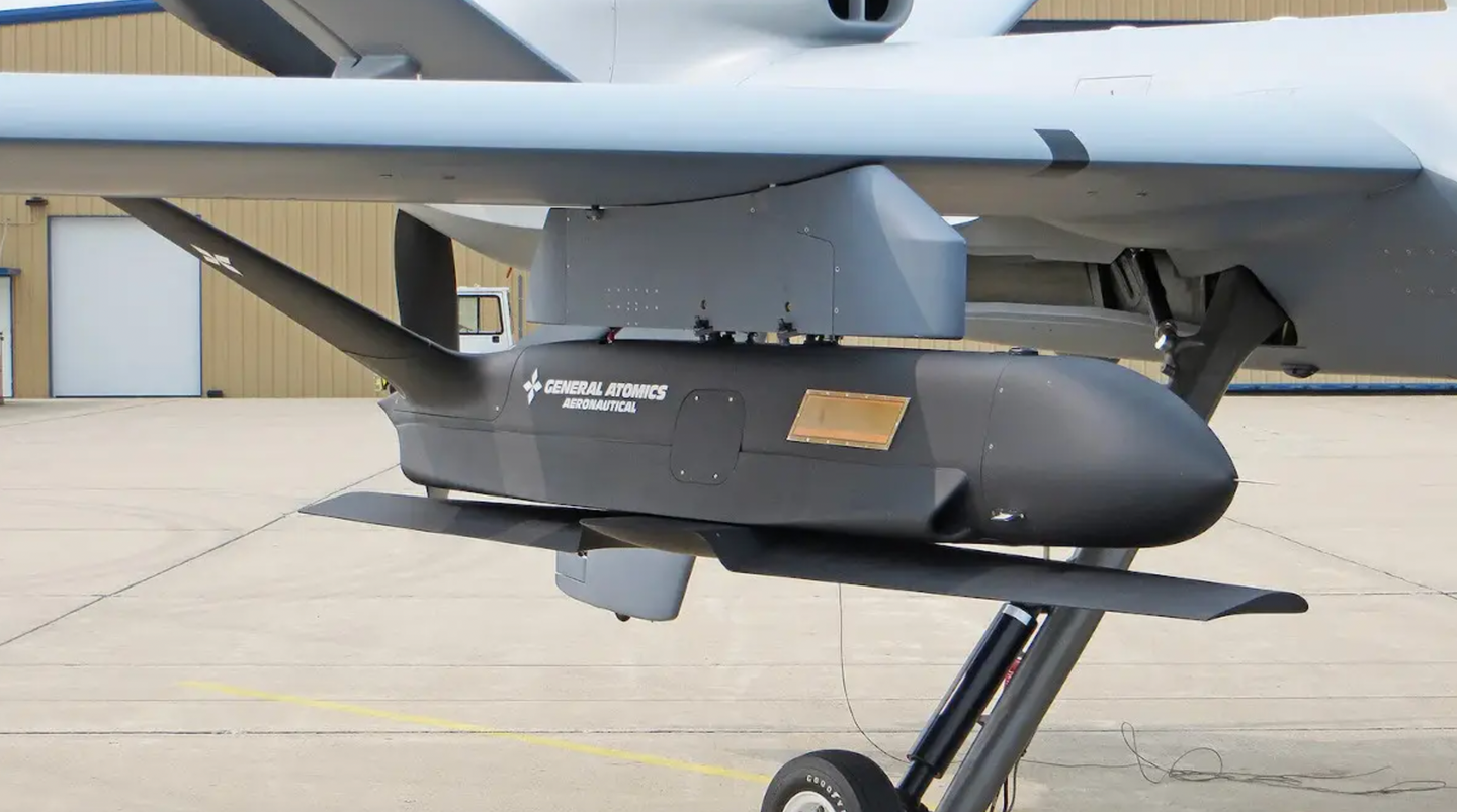 The General Atomics Sparrowhawk, which is designed to be both launched and recovered in mid-air, under the wing of an MQ-9.&nbsp;<em>GA-ASI</em>
