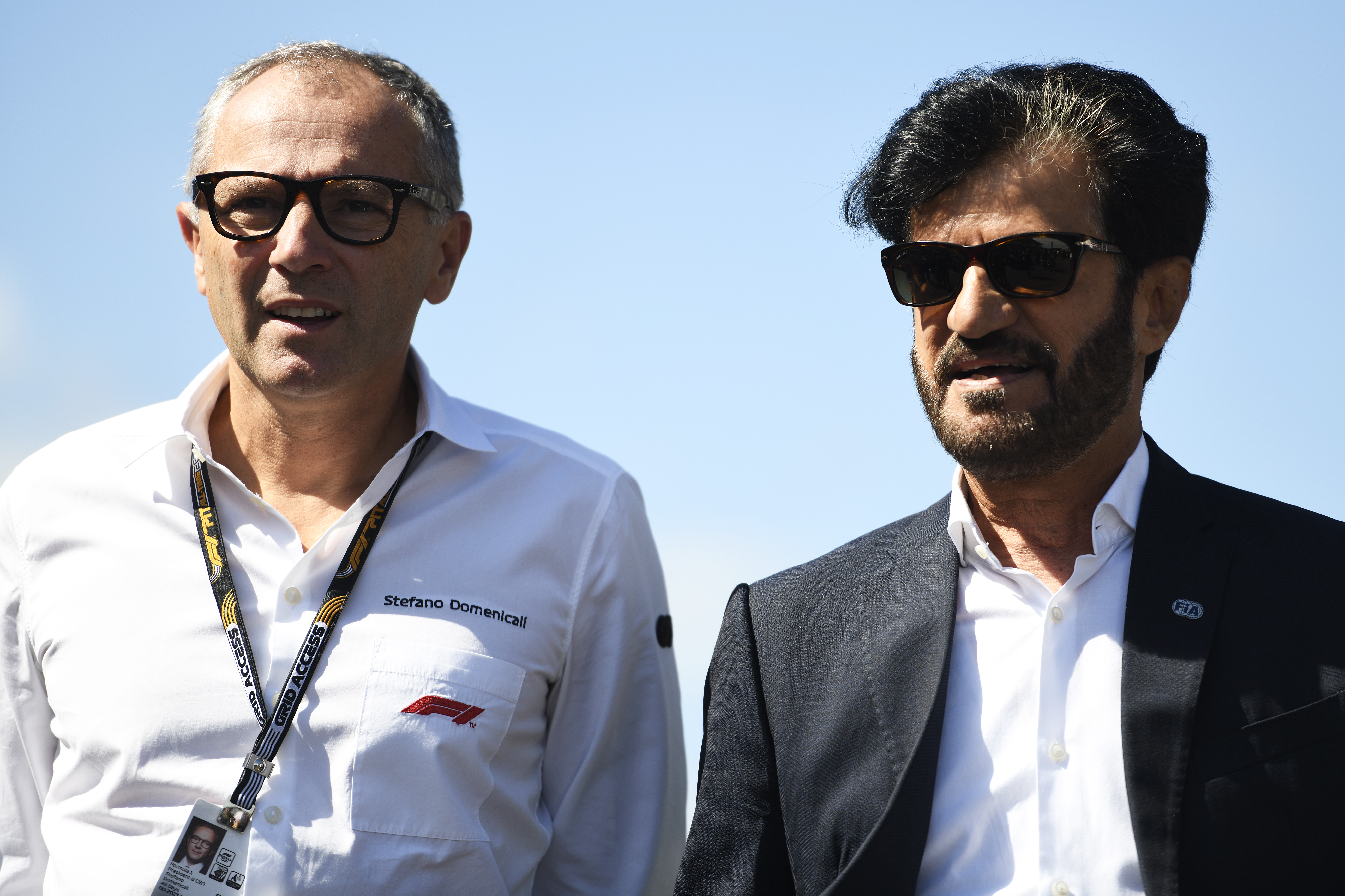 SUZUKA, JAPAN - SEPTEMBER 24: Stefano Domenicali, CEO of the Formula One Group, and Mohammed ben Sulayem, FIA President, talk on the grid during the F1 Grand Prix of Japan at Suzuka International Racing Course on September 24, 2023 in Suzuka, Japan. (Photo by Rudy Carezzevoli/Getty Images)