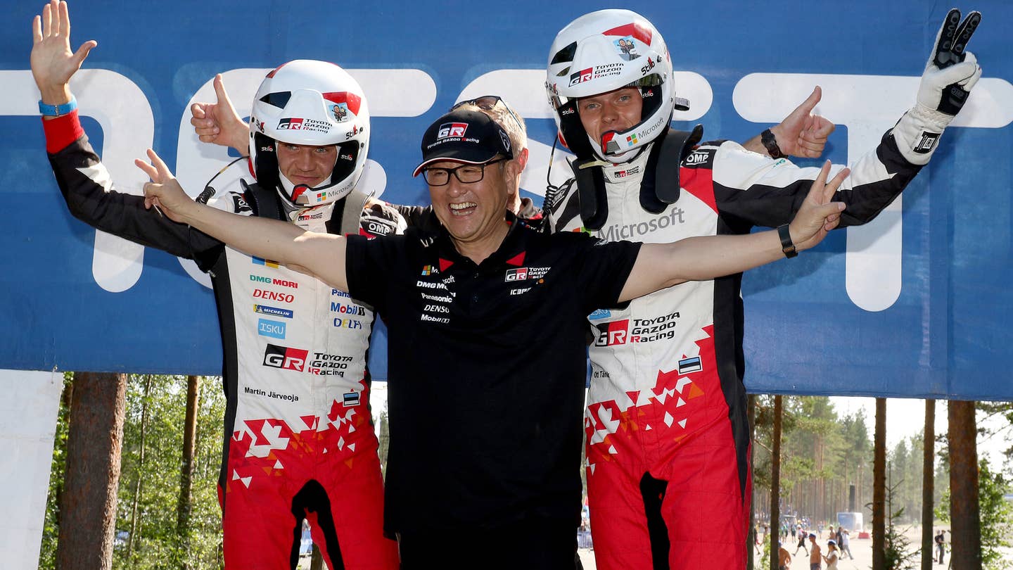 Former Toyota CEO, now Chairman Akio Toyoda, center, poses with Martin Jarveoja and Ott Tanak of the Toyota Gazoo Racing World Rally Team after the 2018 Rally Finland.