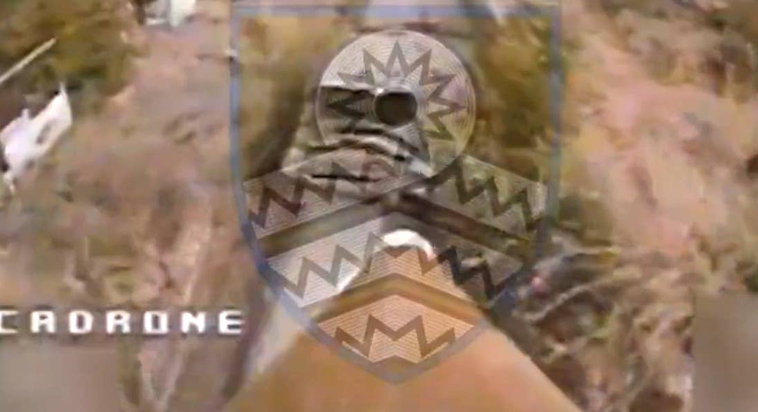 A screen capture from the TOS-1A attack video with the front of the warhead, which looks to be a PG-7 or similar round intended to fired from an RPG-7 launcher, visible at the bottom. <em>via X</em>