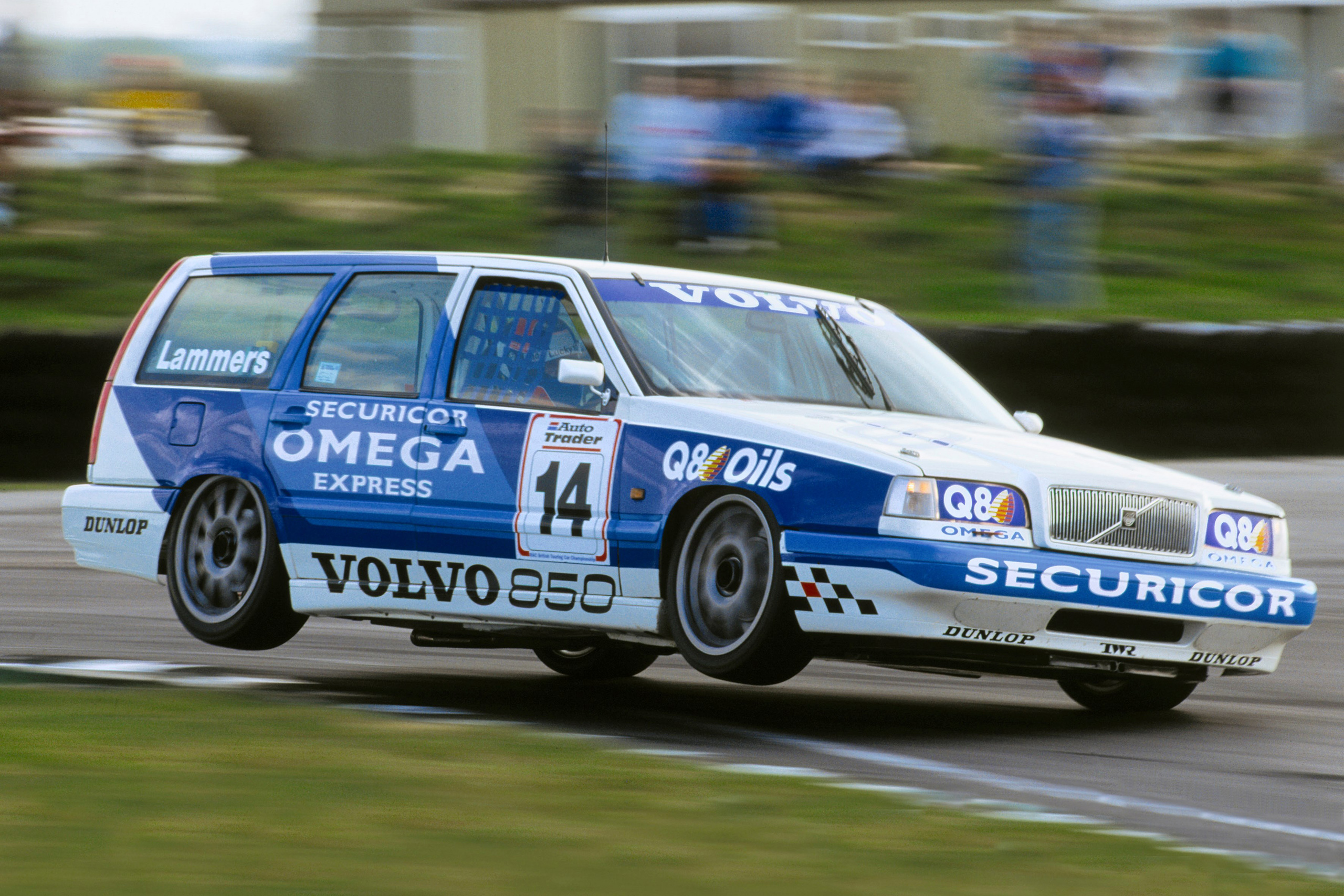 Volvo 850 Estate BTCC touring car up on two wheels during a race.