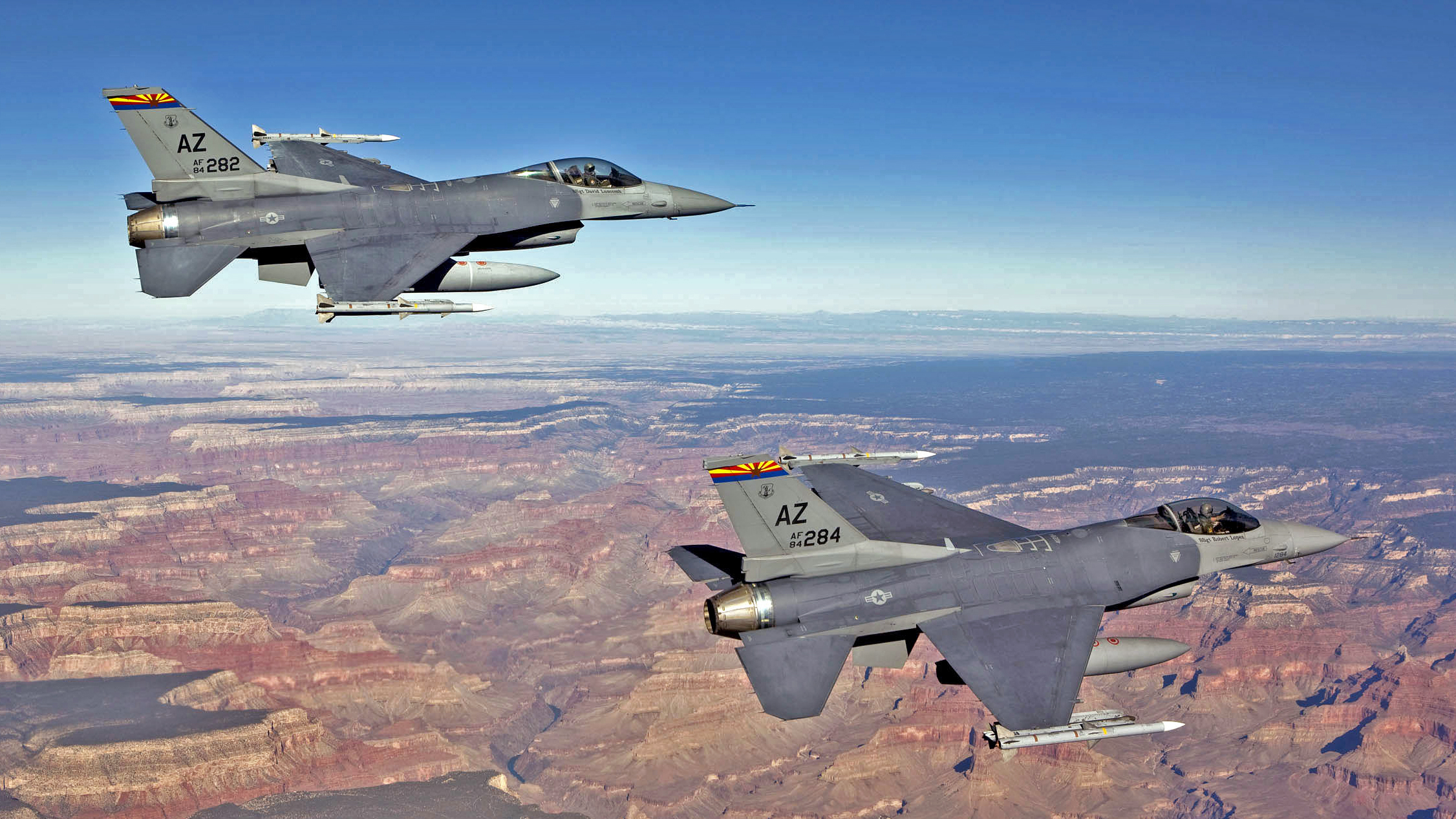Capt. Bob Peel, left, and Lt. Col. Tony Adamo, right, F-16 instructor pilots from the 162nd Fighter Wing, fly over the Grand Canyon while supporting Operation Noble Eagle’s air sovereignty alert mission.