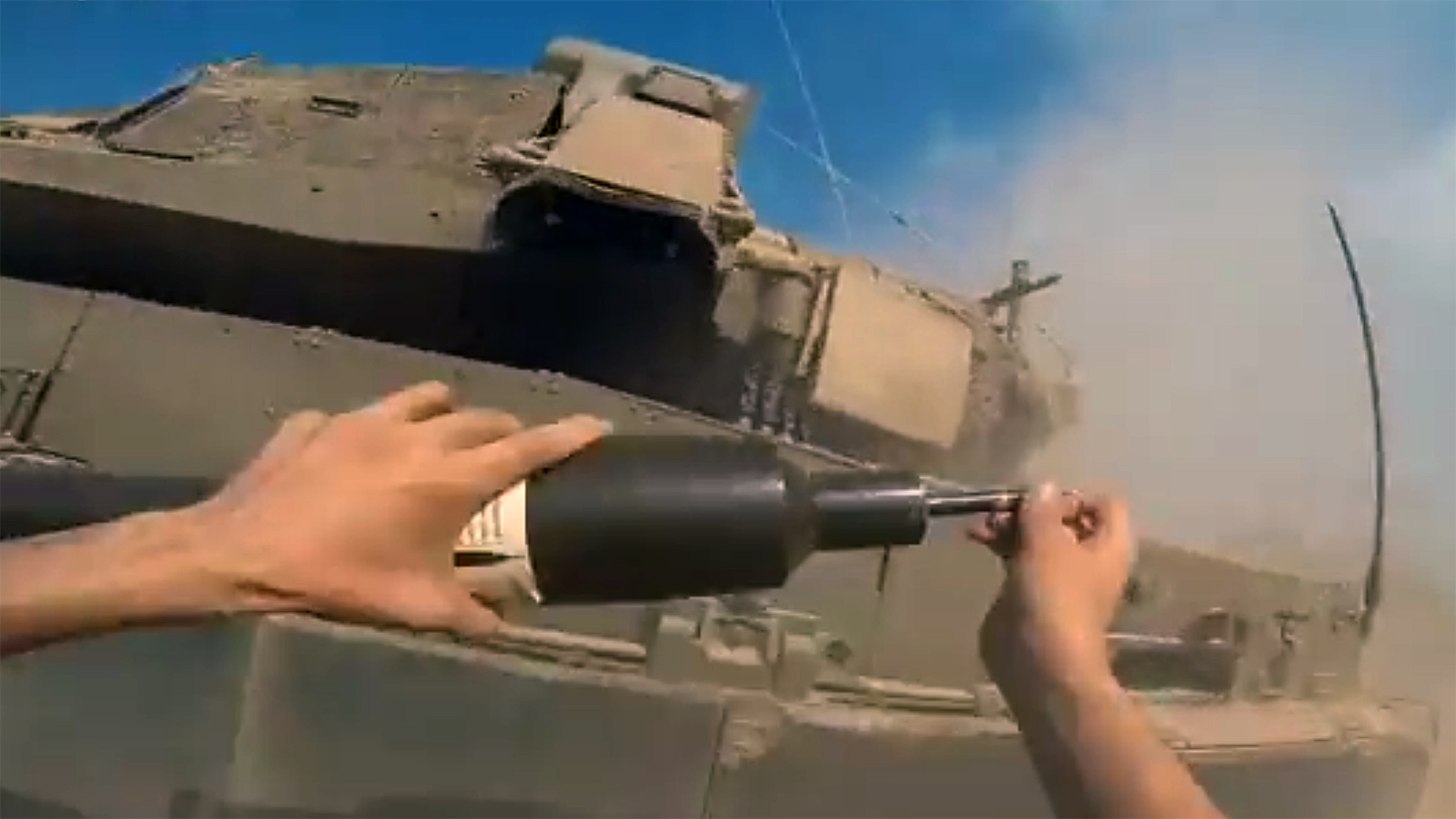 Wild new video shows a Hamas fighter run toward an Israeli tank and place an IED on it.