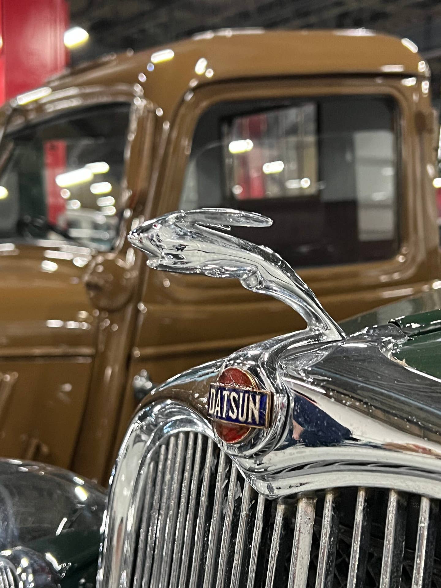 Datsun "dashing rabbit" hood ornament on an early pickup truck.