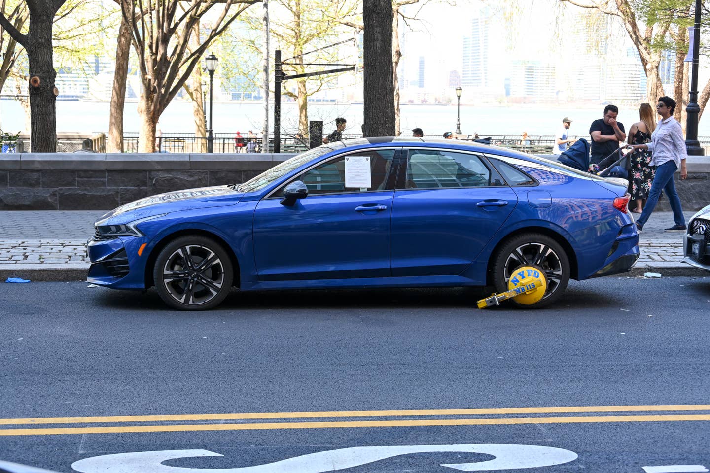 A parked car in New York City immobilized by a "boot."