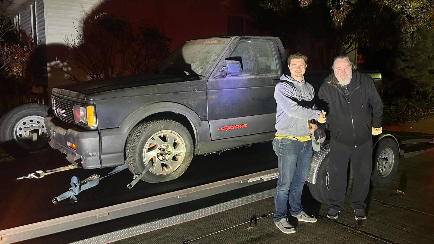 Jake Rowe poses in front of his new GMC Syclone with George Bowman, its former owner