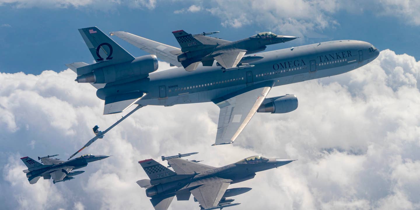 A commercial KDC‐10 tanker aircraft refuels a U.S. Air Force F‐16 Fighting Falcon from the 51st Fighter Wing, enroute Commando Sling 23 at Paya Lebar Air Base, Singapore, November 6, 2023.