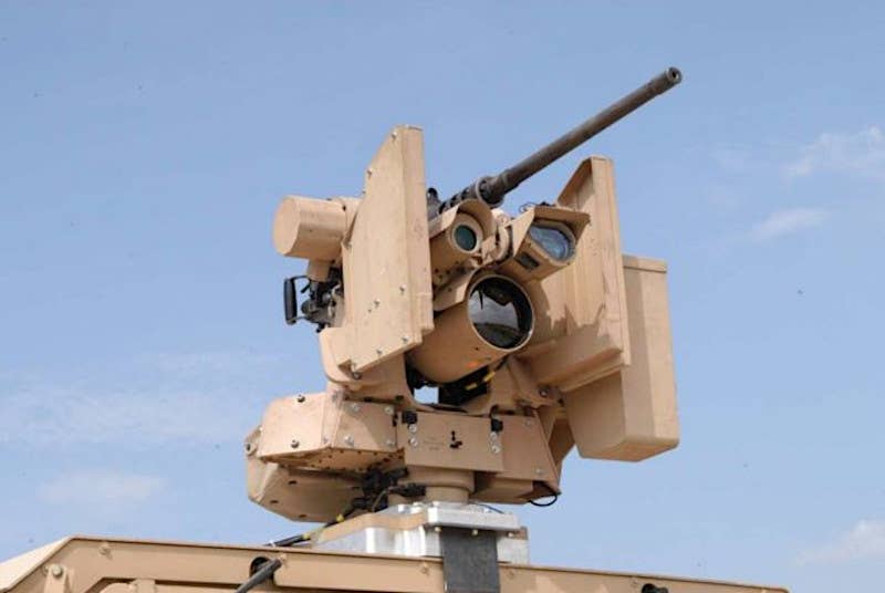 A stock image of a standard CROWS II turret, seen armed here with a .50 caliber M2 machine gun and mounted on a 4x4 Humvee vehicle. <em>US Army</em>