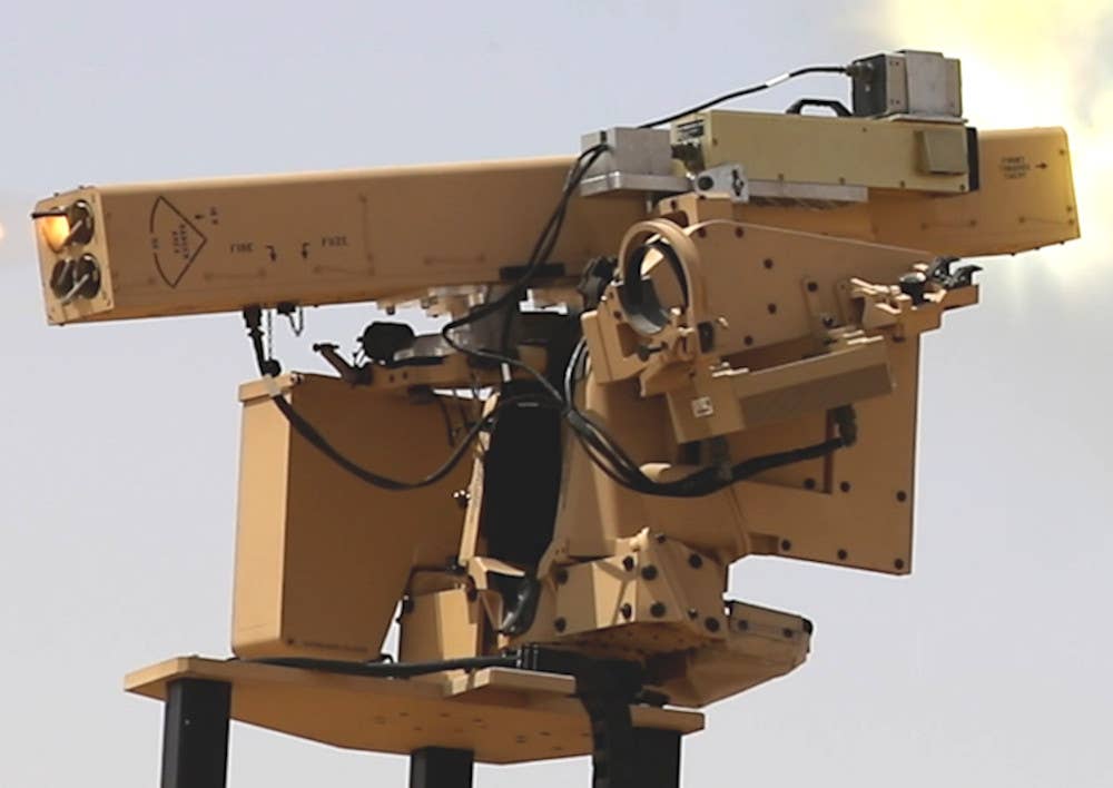 A close-up of the modified CROWS II fitted with the LAND-LGR4 launcher and the added sensor or other system (silver/gray rather than tan). <em>US Army</em>