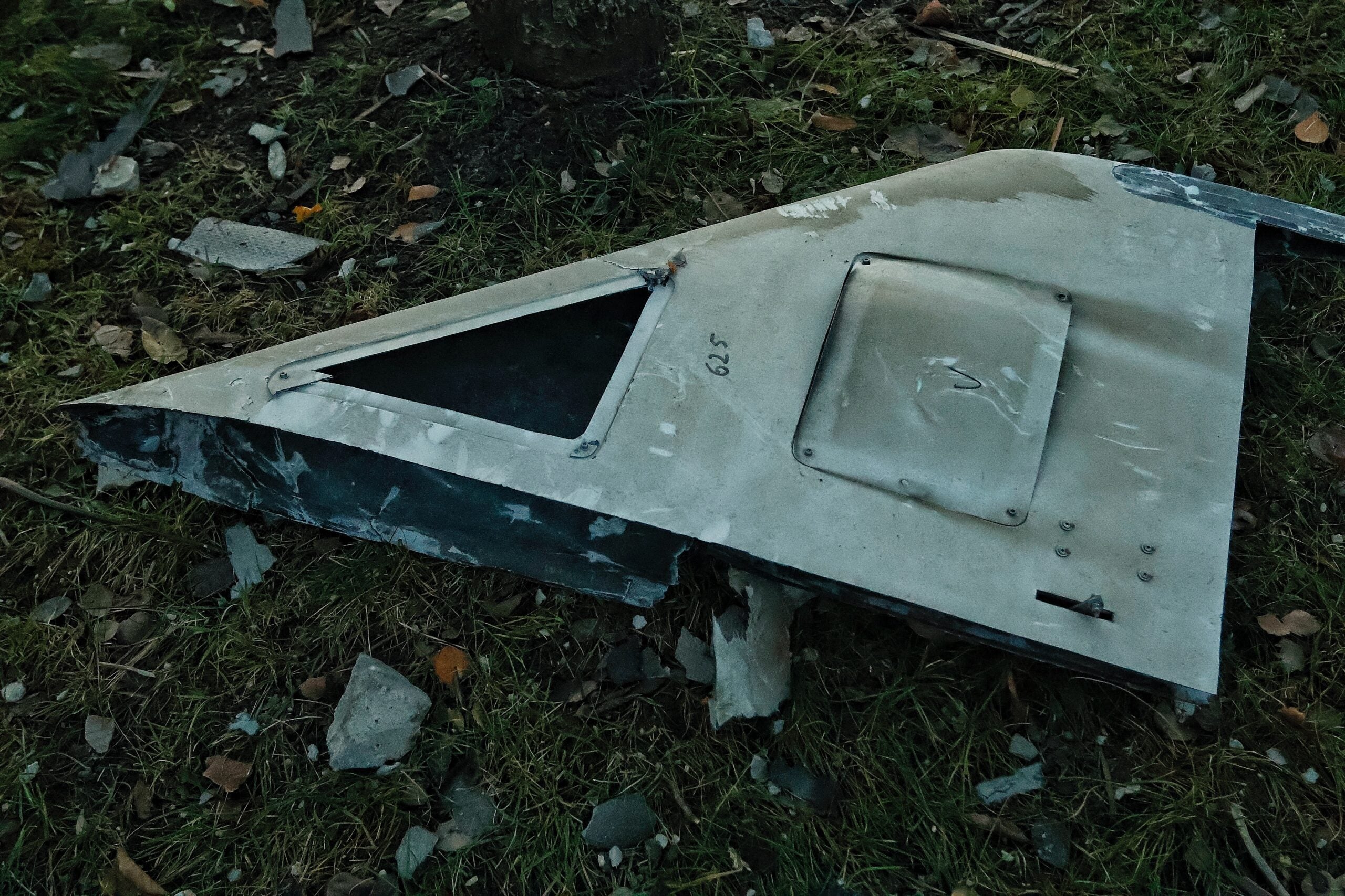 KYIV, UKRAINE - NOVEMBER 25: A drone fragment lies in the yard of a residential building in Solomianskyi district on November 25, 2023 in Kyiv, Ukraine. Russian forces launched several drone attacks across Kyiv during the early hours of Nov. 25, injuring civilians and damaging the city's infrastructure in a few districts. At least six dozen air targets were intercepted by Ukrainian Air Defense Forces. (Photo by Yan Dobronosov/Global Images Ukraine via Getty Images)