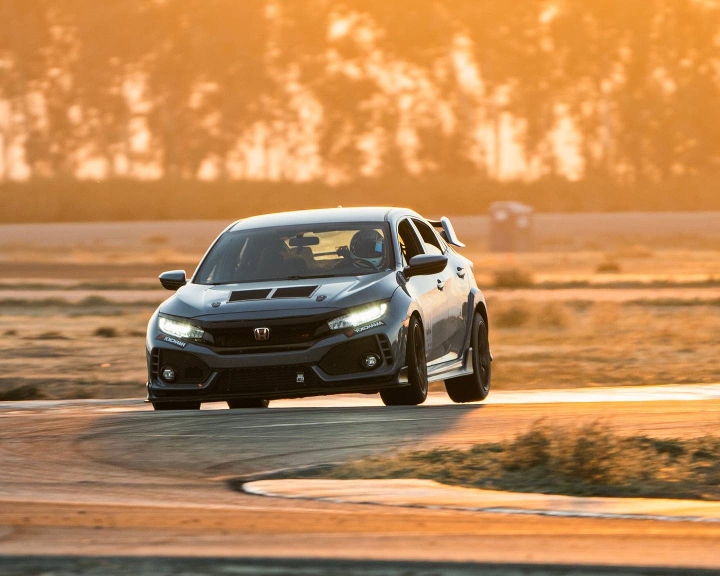 Chris Rosales doing what he does best (on three wheels) in his Civic Type R.