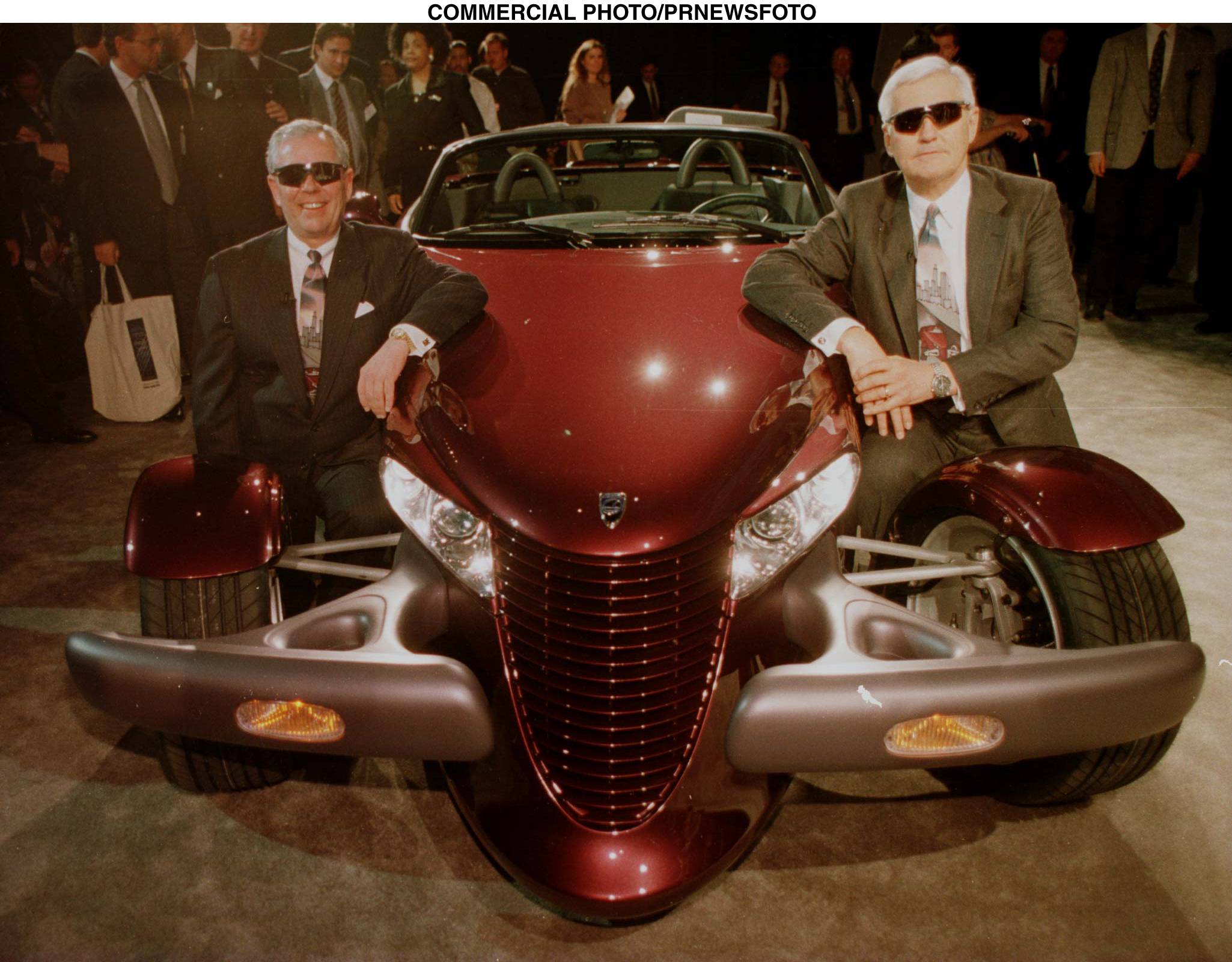 Chrysler Chairman Robert Eaton(L) and President Robert Lutz pose with the Prowler, in their sunglasses, after its introduction at the North American International Auto Show1/3.