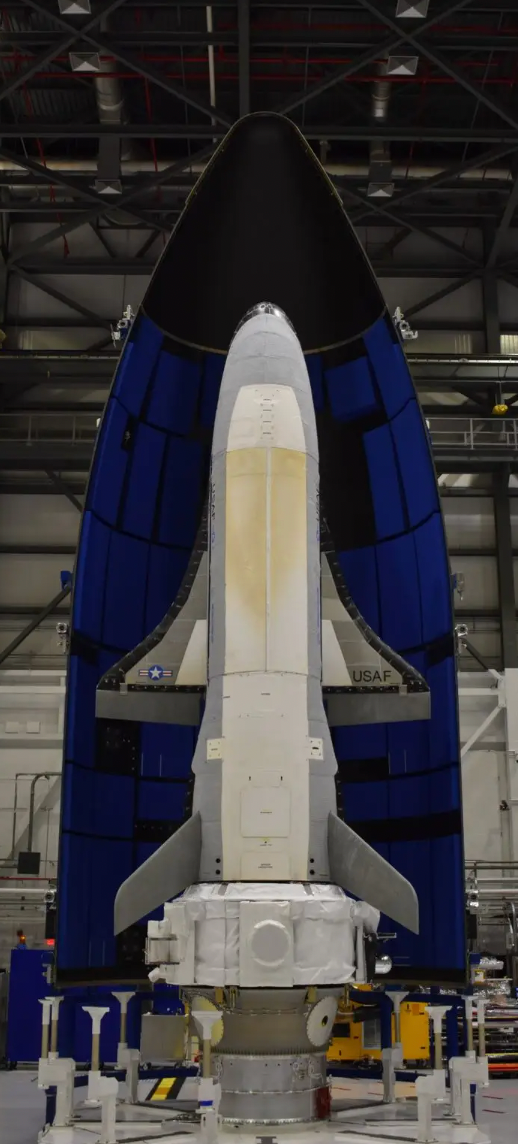 The X-37B orbital test vehicle ahead of its sixth mission, with the service module attached to its rear portion.&nbsp;<em>U.S. Space Force</em>