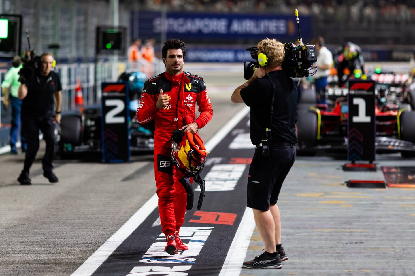 SINGAPORE, SINGAPORE - SEPTEMBER 16: Pole position qualifier Carlos Sainz of Spain and Ferrari celebrates in parc ferme during qualifying ahead of the F1 Grand Prix of Singapore at Marina Bay Street Circuit on September 16, 2023 in Singapore, Singapore. (Photo by Clive Rose/Getty Images)