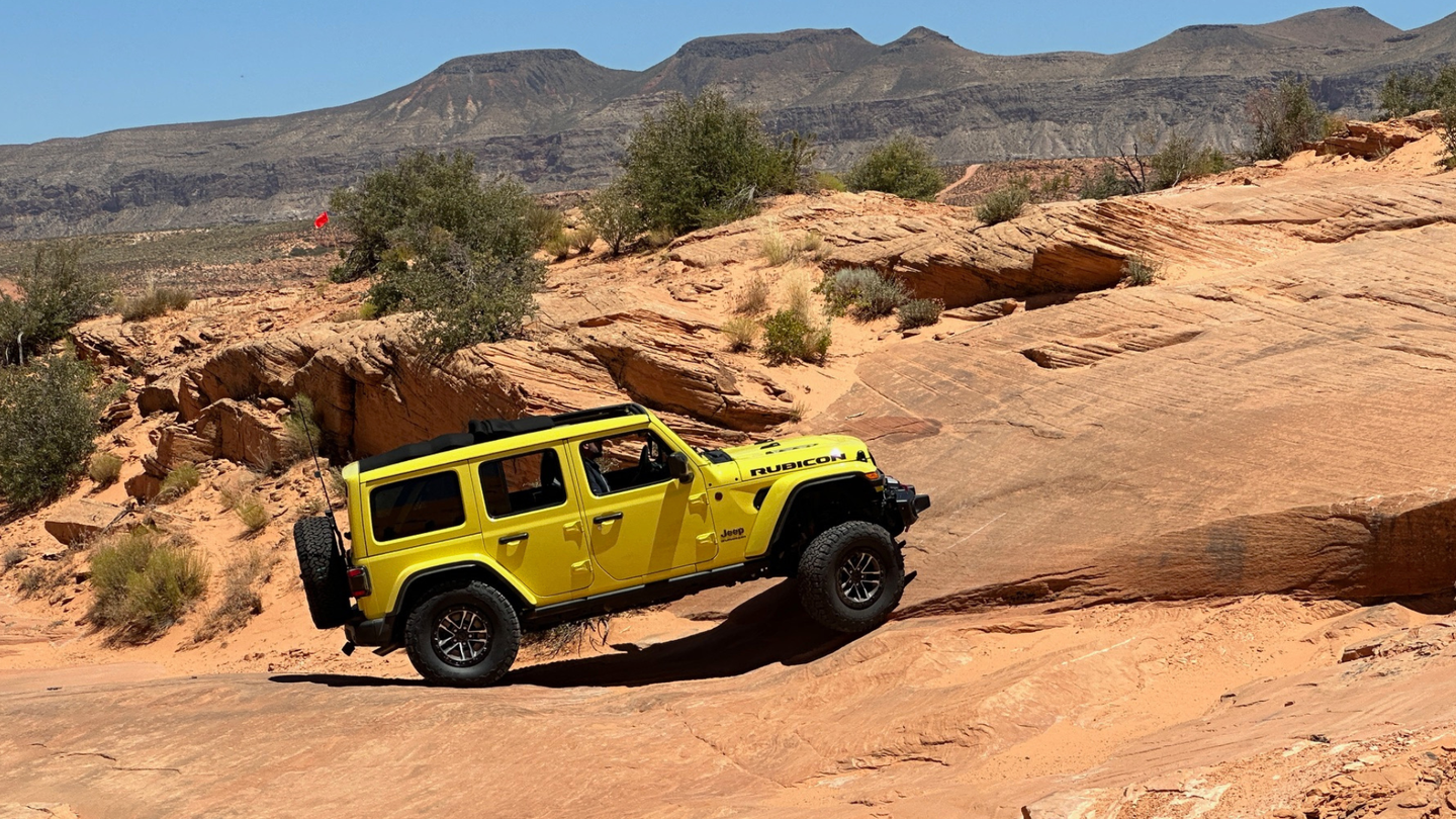 A yellow vehicle on rocky terrain