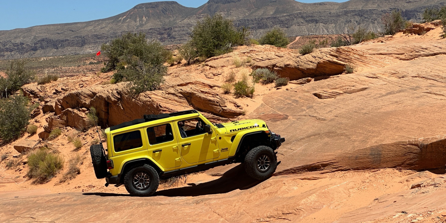 A yellow vehicle on rocky terrain