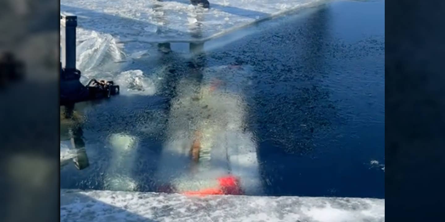 Sunken Ford Super Duty Dives 22 Feet Into Frozen Lake With Trailer Attached