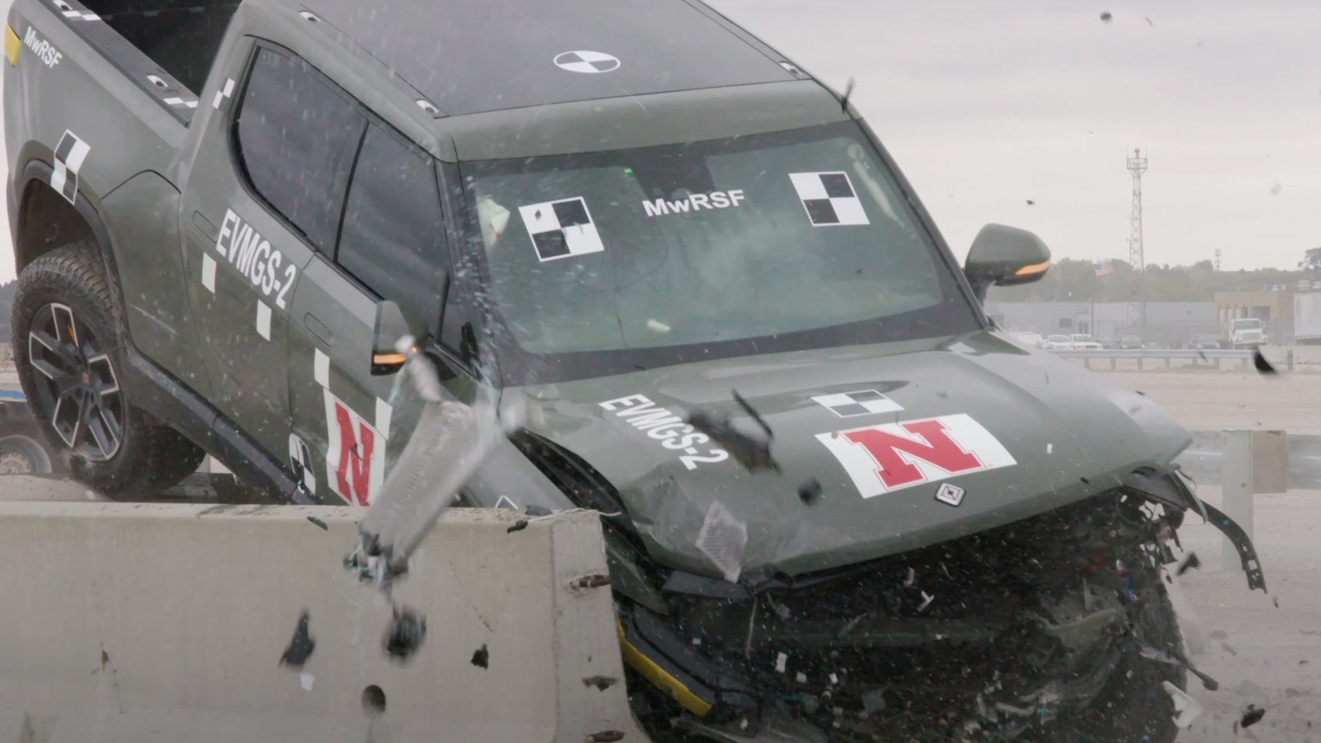 Witness a 7,000-pound Rivian R1T demolish a guardrail in a jaw-dropping test.