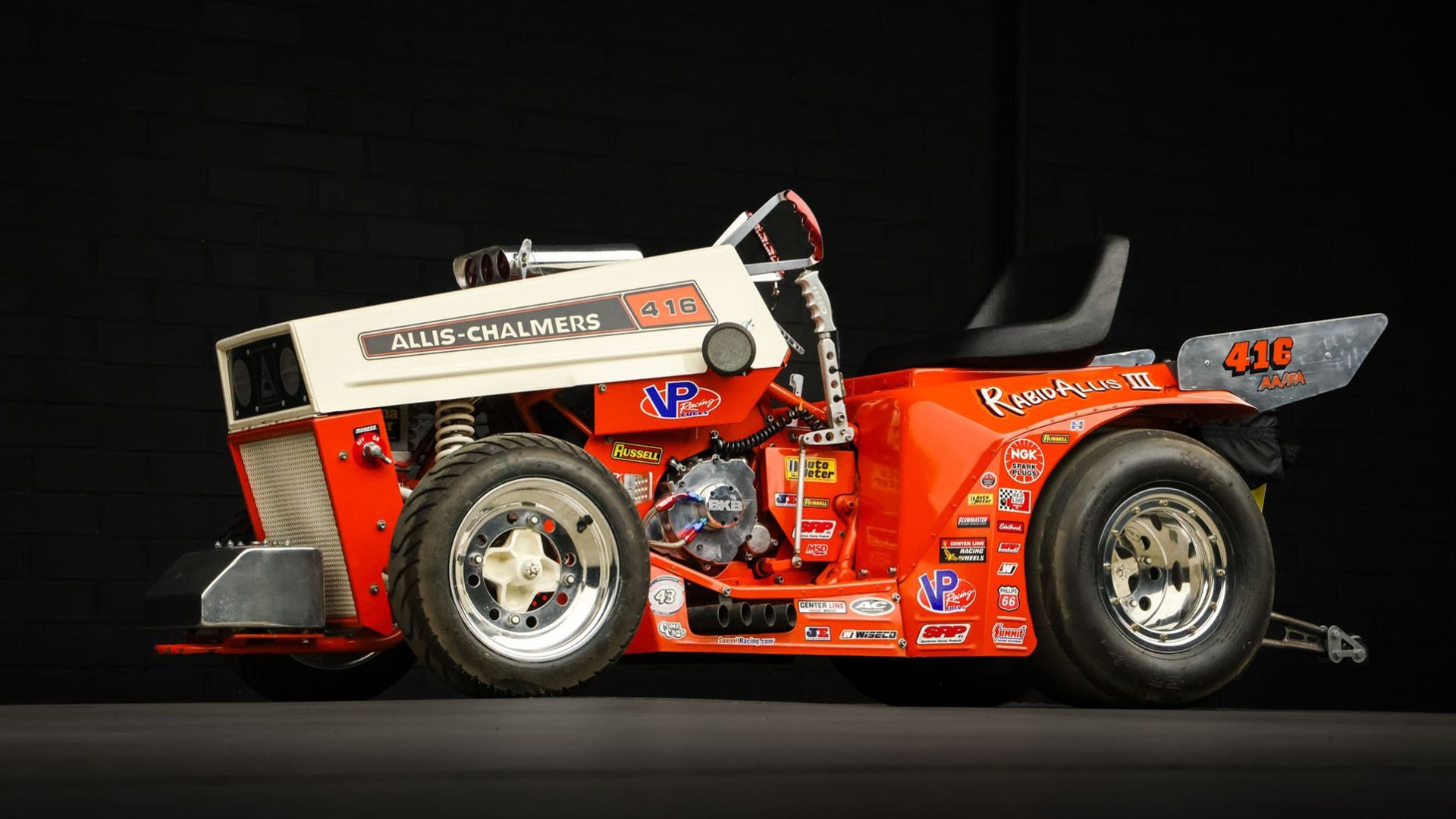 The Allis-Chalmers lawn dragster is powered by nitromethane and produces ear-splitting screams as it races.