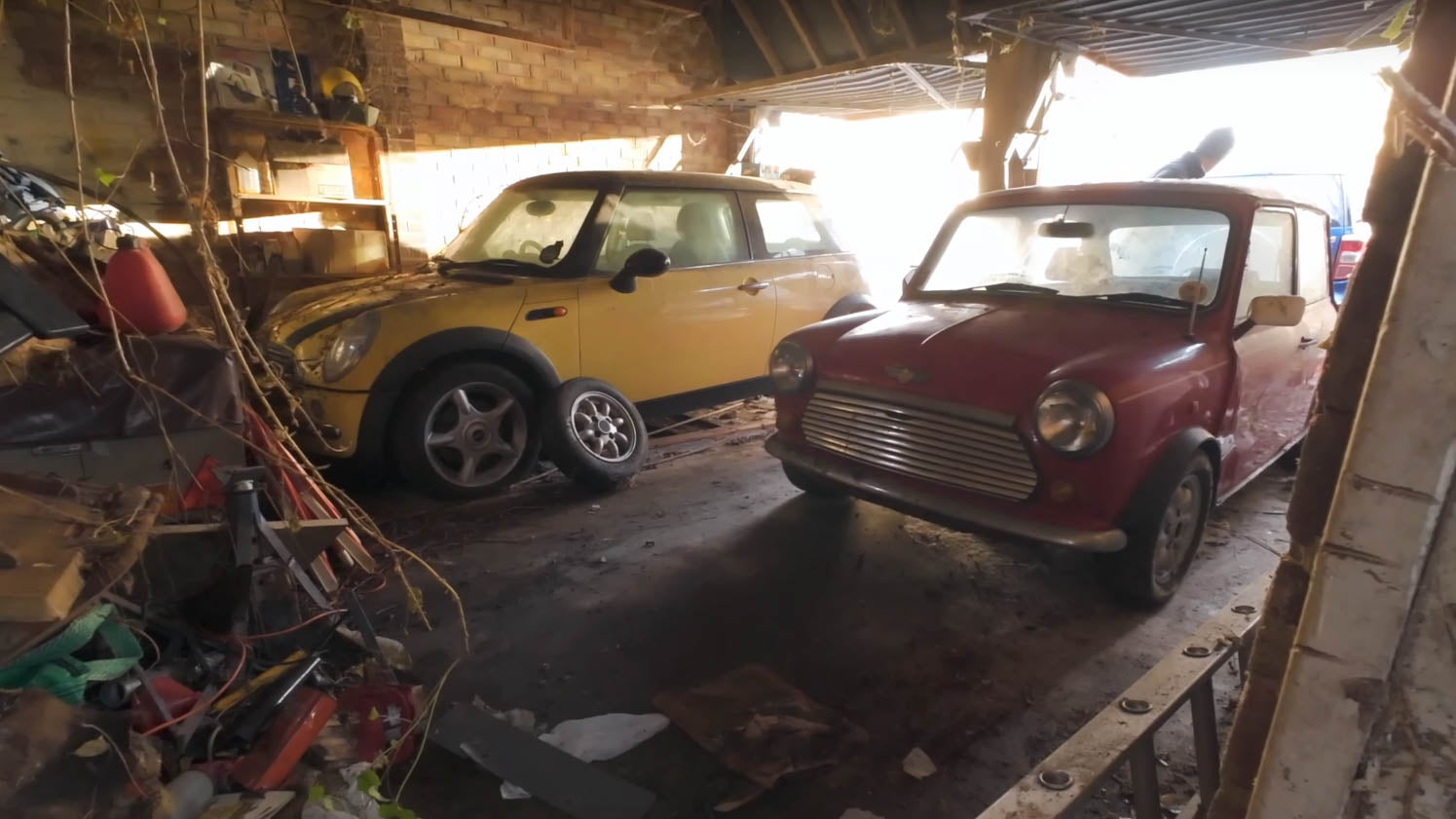 Two Mini Coopers found in a barn were finally rescued from their overgrown garage.