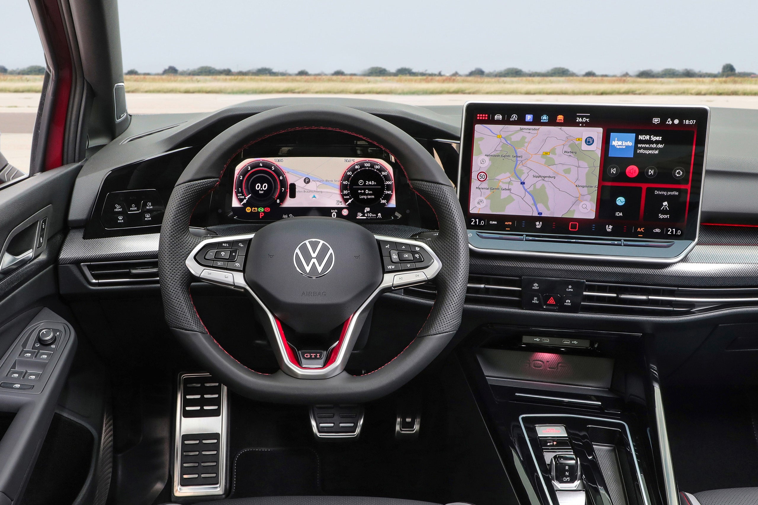 The 2025 Volkswagen GTI's updated interior features button on the steering wheel.