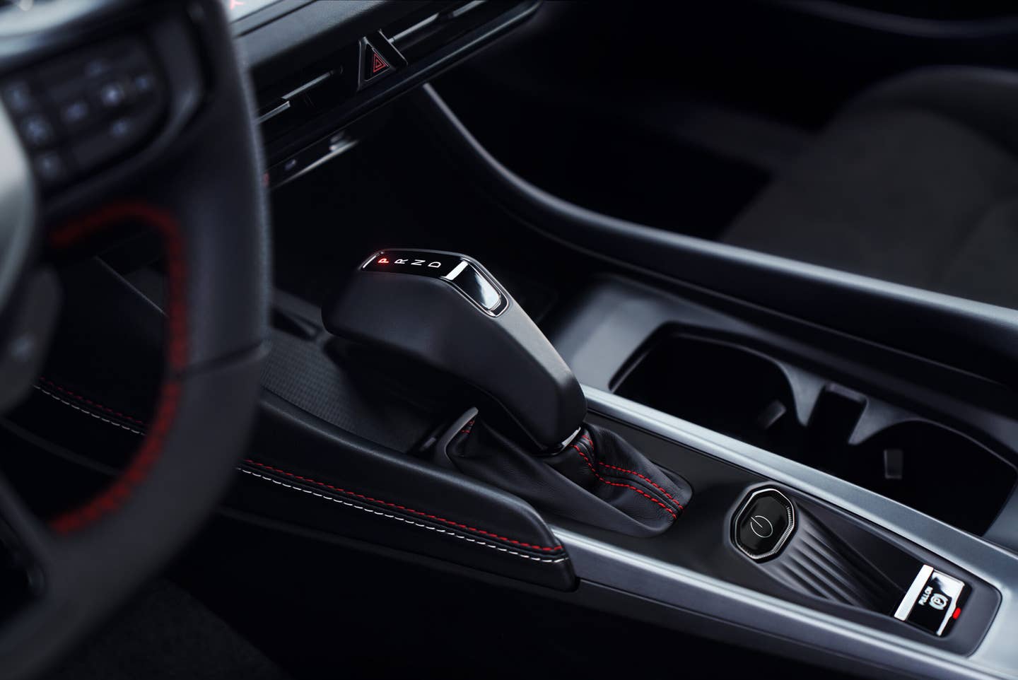 An all-new, modern "pistol-grip" shifter and the start/power button are packaged close together on the center console of the all-new Dodge Charger, which also incorporates a wireless phone charger.